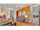 Cozy living room with hardwood floors, decorative touches, and lots of natural light at 729 Manns Harbor Drive, Apollo Beach, FL 33572