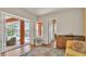 Relaxing room boasting sliding doors to the pool, hardwood floors, and comfortable seating at 729 Manns Harbor Drive, Apollo Beach, FL 33572