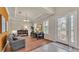 Cozy living room with hardwood floors, stylish decor, and lots of natural light at 729 Manns Harbor Drive, Apollo Beach, FL 33572