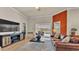 A cozy living room boasts a leather sofa, a TV console, and an area rug at 729 Manns Harbor Drive, Apollo Beach, FL 33572