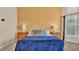 Comfortable main bedroom featuring bedside tables, lamps, and decorative pillows at 729 Manns Harbor Drive, Apollo Beach, FL 33572