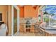 Outdoor kitchen with stainless steel appliances, hood, sink, and stone accents at 729 Manns Harbor Drive, Apollo Beach, FL 33572