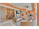 Spacious screened patio with comfortable seating, an outdoor kitchen, and water views at 729 Manns Harbor Drive, Apollo Beach, FL 33572