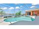 Screened-in pool with a lovely lake view, perfect for relaxing and entertaining outdoors at 729 Manns Harbor Drive, Apollo Beach, FL 33572
