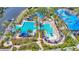 Community swimming pool featuring a slide and separate areas for swimming laps or enjoying water activities at 729 Manns Harbor Drive, Apollo Beach, FL 33572