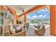 Inviting screened lanai with outdoor seating, a pool, spa, and waterfront views at 729 Manns Harbor Drive, Apollo Beach, FL 33572