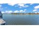 Scenic waterfront view of the lake with luxury homes on the opposite shoreline at 729 Manns Harbor Drive, Apollo Beach, FL 33572