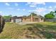 Spacious backyard with a large concrete patio and shed at 8184 Rose Ter, Seminole, FL 33777