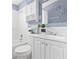 Fresh bathroom with white tiling, vanity and medicine cabinet providing storage solutions at 8184 Rose Ter, Seminole, FL 33777