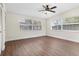 Bedroom with hardwood floors, ceiling fan, lots of natural light, and a spacious closet at 8184 Rose Ter, Seminole, FL 33777