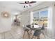 Bright dining area with tile floors, natural light and modern table set at 8184 Rose Ter, Seminole, FL 33777