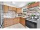 Well-equipped kitchen featuring sleek appliances, ample counter space, and tile flooring at 8184 Rose Ter, Seminole, FL 33777
