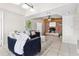 Cozy living room with brick fireplace, tiled flooring, recessed lighting and comfortable seating at 8184 Rose Ter, Seminole, FL 33777