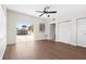 Spacious living room with sliding glass doors to the backyard and sleek, modern flooring at 8184 Rose Ter, Seminole, FL 33777
