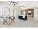 Inviting living space featuring tile floors, a cozy fireplace, and a dining area at 8184 Rose Ter, Seminole, FL 33777