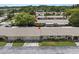 Community featuring well-maintained landscaping, neatly arranged homes, and convenient parking at 834 Cambridge Ct, Dunedin, FL 34698