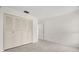 Clean, empty bedroom with tile flooring and a closet at 834 Cambridge Ct, Dunedin, FL 34698