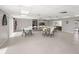 Versatile clubhouse space with tables, chairs, and plenty of room for activities and gatherings at 834 Cambridge Ct, Dunedin, FL 34698