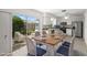 Eat in kitchen featuring modern appliances, white cabinets, and a breakfast area with sliding door to backyard at 834 Cambridge Ct, Dunedin, FL 34698