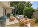 Outdoor patio area perfect for entertaining featuring comfortable seating and lush landscaping at 834 Cambridge Ct, Dunedin, FL 34698