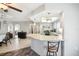 Open layout connecting kitchen and dining areas, featuring sleek granite countertops at 8413 Moulton Dr, Port Richey, FL 34668
