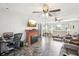Comfortable living room featuring tile flooring, a fireplace, and an open layout at 8413 Moulton Dr, Port Richey, FL 34668