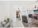 Inviting living room with tile flooring, ceiling fan and an open layout at 8413 Moulton Dr, Port Richey, FL 34668