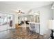 Open floor plan with bar seating, offering versatile living and dining options at 8413 Moulton Dr, Port Richey, FL 34668
