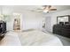The main bedroom is furnished with a dresser and has access to the bathroom and other rooms at 8413 Moulton Dr, Port Richey, FL 34668
