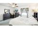 A spacious main bedroom featuring a bed, dresser, window, and TV at 8413 Moulton Dr, Port Richey, FL 34668