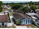 Aerial view of the neighborhood, trees, sheds, and homes at 9206 Wood Lake Blvd, Tampa, FL 33615