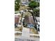 An aerial view showcases the backyard and surrounding houses at 9206 Wood Lake Blvd, Tampa, FL 33615