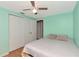Light and airy bedroom features fresh paint, carpet, and a spacious closet, creating a comfortable and inviting retreat at 9206 Wood Lake Blvd, Tampa, FL 33615