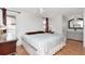 Cozy bedroom with wood floors, plenty of natural light and ensuite bathroom at 9206 Wood Lake Blvd, Tampa, FL 33615