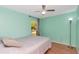 Simple bedroom featuring wood flooring, a neutral color scheme and lots of light at 9206 Wood Lake Blvd, Tampa, FL 33615