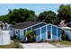 A charming one-story home is showcased with its neatly maintained front yard at 9206 Wood Lake Blvd, Tampa, FL 33615