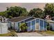 A charming one-story home is showcased with its neatly maintained front yard at 9206 Wood Lake Blvd, Tampa, FL 33615