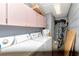 Well-equipped laundry room with washer, dryer, and ample storage cabinets, offering convenience and organization at 9206 Wood Lake Blvd, Tampa, FL 33615