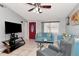 Inviting living room with tile flooring, a red front door, and comfortable seating at 9206 Wood Lake Blvd, Tampa, FL 33615