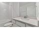 New bathroom offering tub with white tile and quartz countertops on the vanity at 9765 Crescent Moon Dr, Riverview, FL 33578