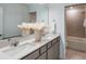 Modern bathroom featuring double sinks, granite countertops and a separate shower and tub at 9768 Crescent Moon Dr, Riverview, FL 33578