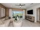 Comfortable living room featuring a sliding door, a neutral color scheme, and modern accents at 9768 Crescent Moon Dr, Riverview, FL 33578