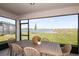 Covered patio with dining area overlooking a serene lake view at 9768 Crescent Moon Dr, Riverview, FL 33578