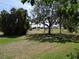 The community has a grassy area with trees and benches in the common area at 9825 41St N St, Pinellas Park, FL 33782