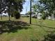 Community with a grassy area and shade trees at 9825 41St N St, Pinellas Park, FL 33782