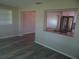 An open kitchen layout featuring stainless steel appliances and a granite countertop at 9825 41St N St, Pinellas Park, FL 33782
