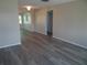 Living room featuring gray wood floors and neutral walls, creating a serene and inviting atmosphere at 9825 41St N St, Pinellas Park, FL 33782