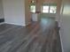 Open-concept living area featuring updated flooring and plenty of natural light at 9825 41St N St, Pinellas Park, FL 33782