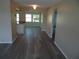 Spacious living room with wood floors and natural light coming in from the dining area at 9825 41St N St, Pinellas Park, FL 33782