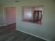 Open living room with view to the renovated kitchen, and modern flooring at 9825 41St N St # 9825, Pinellas Park, FL 33782
